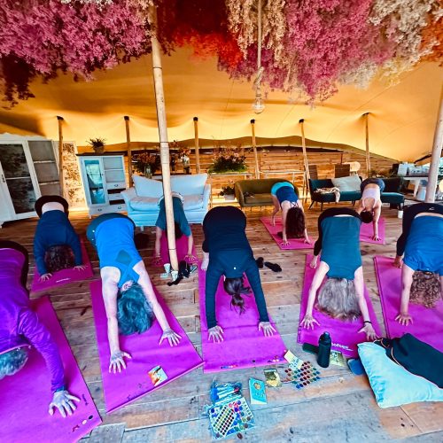 Camino Yoga Escape Participants practicing morning yoga outdoors during the Camino Yoga Escape