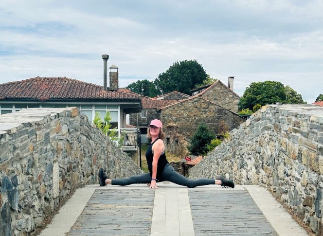 Camino Yoga Escape Pilgrim doing yoga outdoors on the Camino de Santiago, Galicia, Spain