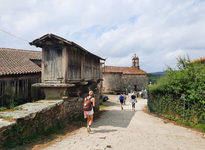Camino Yoga Escape Pilgrims walking through villages on the Camino de Santiago, Galicia, Spain